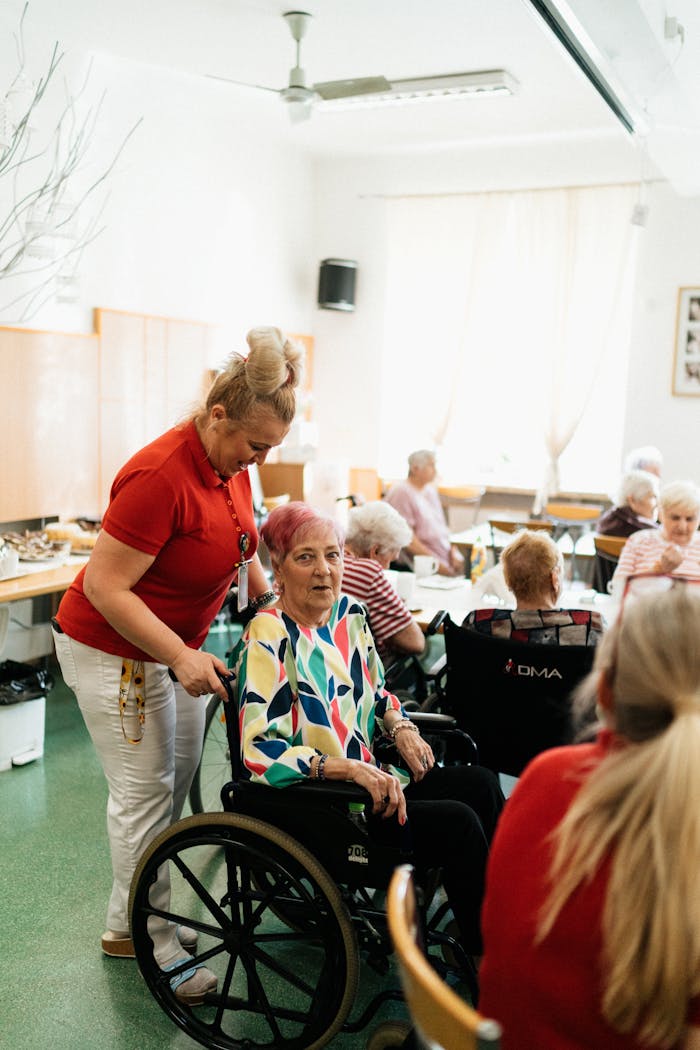 services-01 A caregiver assists a senior in a vibrant community center, promoting well-being.
